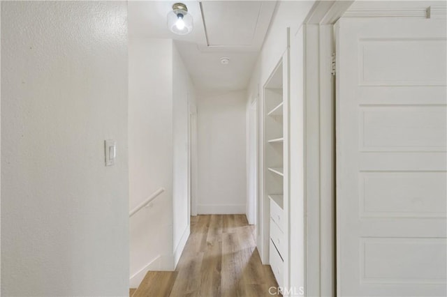 4415 12th St, Riverside, CA 92501 - hall featuring light wood finished floors, attic access, and baseboards