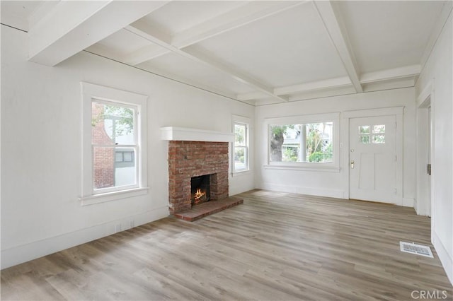 4415 12th St, Riverside, CA 92501 - unfurnished living room with wood finished floors, beam ceiling, baseboards, a fireplace, and coffered ceiling