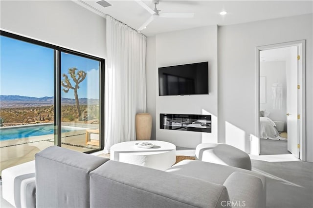 59425 Sun Mesa Rd, Yucca Valley, CA 92284 - living room featuring a mountain view, a ceiling fan, and recessed lighting
