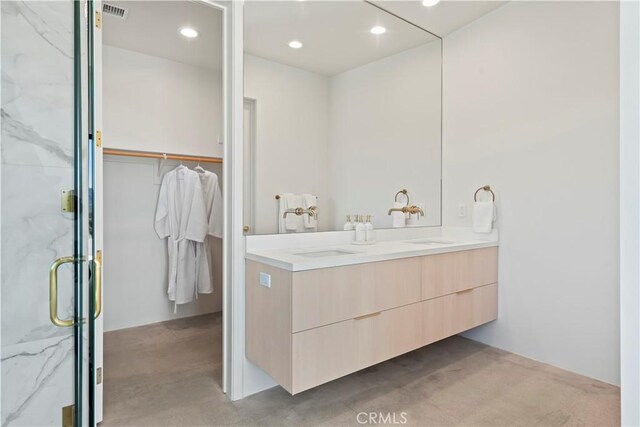 59425 Sun Mesa Rd, Yucca Valley, CA 92284 - bathroom featuring double vanity, a marble finish shower, and recessed lighting