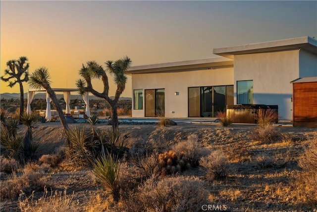59425 Sun Mesa Rd, Yucca Valley, CA 92284 - rear view of house with a hot tub