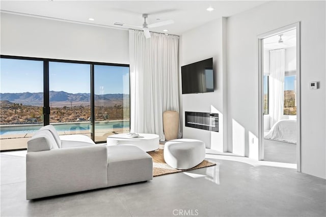 59425 Sun Mesa Rd, Yucca Valley, CA 92284 - living room with ceiling fan, concrete flooring, and recessed lighting