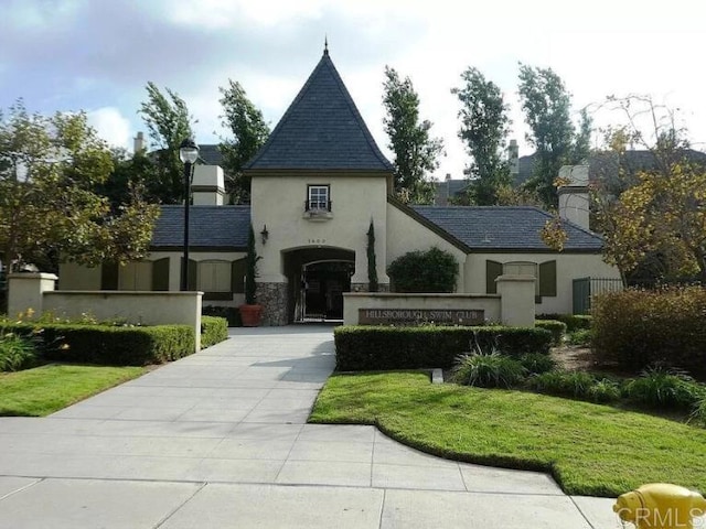 1875 Baudouin Pl Unit 1731, Chula Vista, CA 91913 - french provincial home featuring stucco siding, a chimney, and stone siding