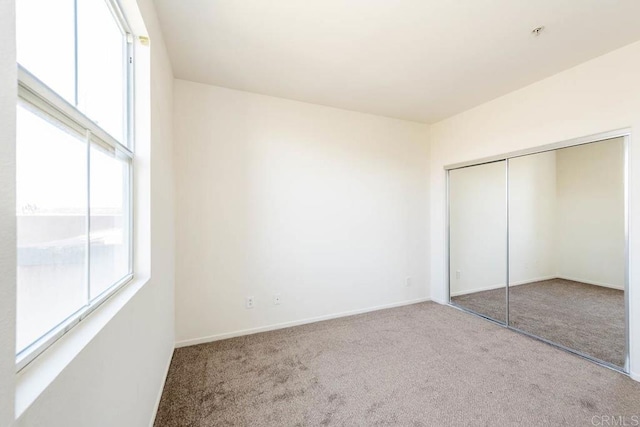 1875 Baudouin Pl Unit 1731, Chula Vista, CA 91913 - unfurnished bedroom featuring carpet flooring, a closet, and baseboards