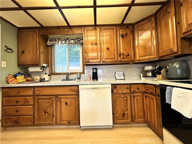 950 Cedar St, Corona, CA 92879 - kitchen featuring dishwasher, range, light wood-style flooring, and brown cabinets