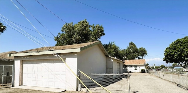 950 Cedar St, Corona, CA 92879 - view of home's exterior featuring a detached garage and stucco siding