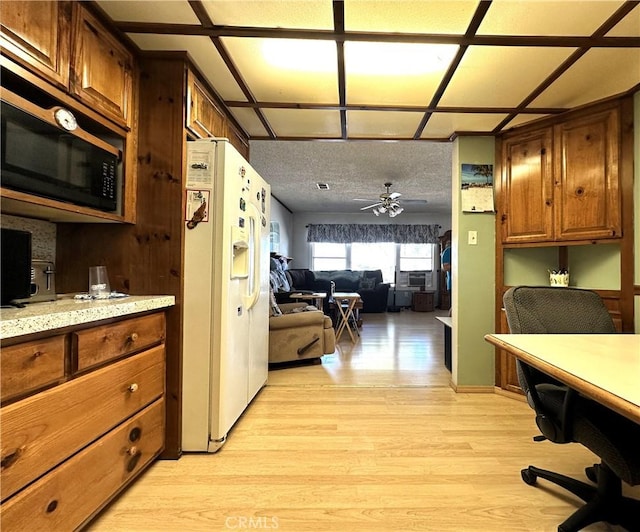 950 Cedar St, Corona, CA 92879 - kitchen featuring white refrigerator with ice dispenser, light wood-style flooring, an office area, ceiling fan, and black microwave