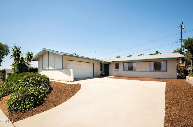 815 Perry Ave, Montebello, CA 90640 - ranch-style house featuring a garage, concrete driveway, and stucco siding