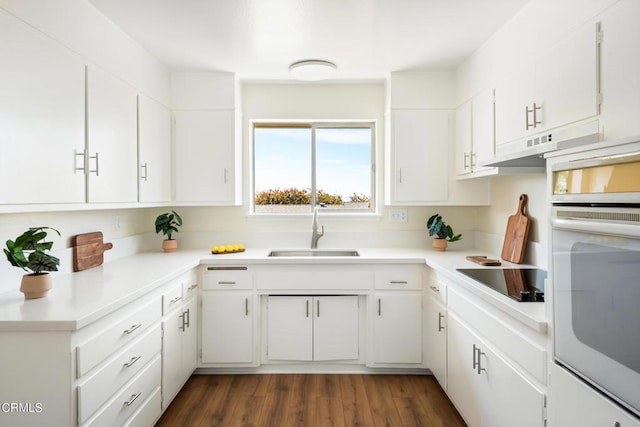 815 Perry Ave, Montebello, CA 90640 - kitchen with a sink, oven, black electric cooktop, and white cabinets