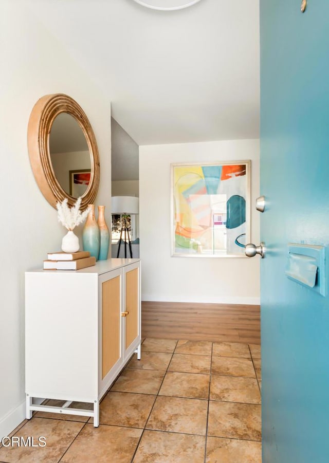 815 Perry Ave, Montebello, CA 90640 - corridor featuring light tile patterned floors and baseboards