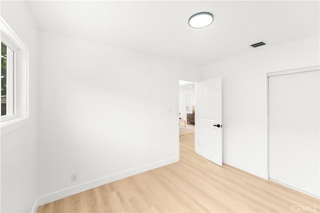430 N Ellen Dr, West Covina, CA 91790 - unfurnished bedroom with light wood-type flooring and a closet