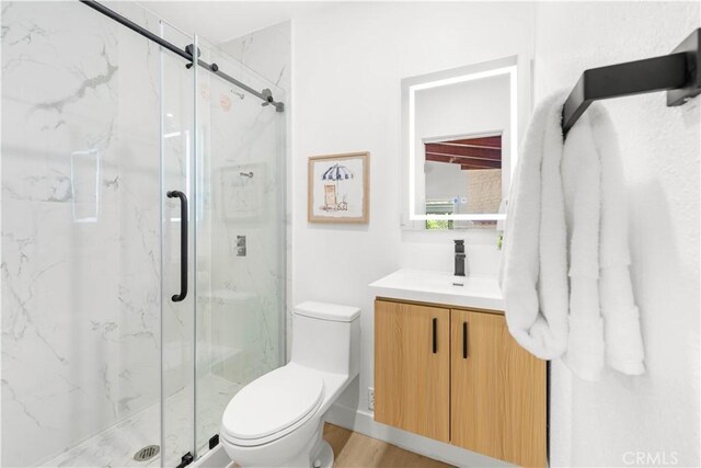 430 N Ellen Dr, West Covina, CA 91790 - full bath with vanity, a marble finish shower, and wood finished floors