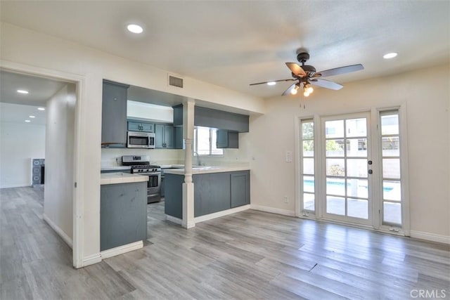 11112 Camellia Ave, Fountain Valley, CA 92708 - kitchen featuring appliances with stainless steel finishes, light wood-style flooring, light countertops, a ceiling fan, and recessed lighting