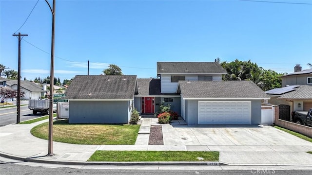 11112 Camellia Ave, Fountain Valley, CA 92708 - traditional-style house with a garage, driveway, a front yard, and stucco siding