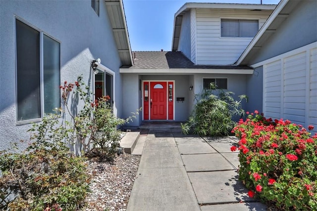 11112 Camellia Ave, Fountain Valley, CA 92708 - doorway to property featuring stucco siding and a shingled roof