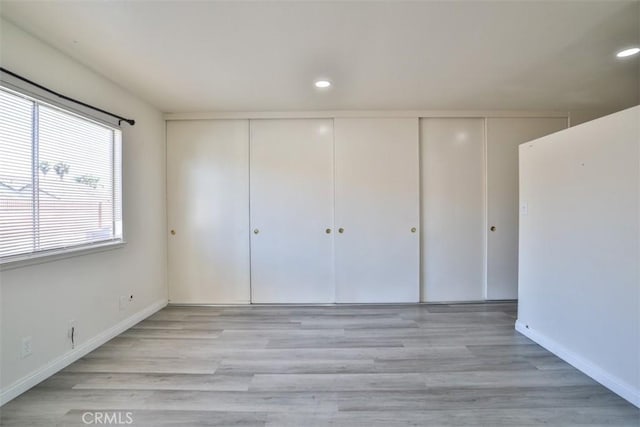 11112 Camellia Ave, Fountain Valley, CA 92708 - unfurnished bedroom with a closet, wood finished floors, recessed lighting, and baseboards