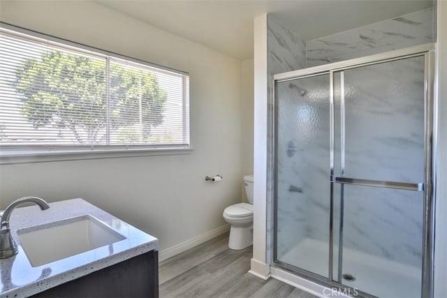 11112 Camellia Ave, Fountain Valley, CA 92708 - full bathroom with toilet, a stall shower, wood finished floors, baseboards, and vanity