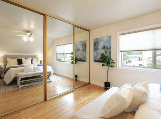 1163 Sandwood Pl, San Pedro, CA 90731 - bedroom with wood finished floors, a closet, multiple windows, and baseboards