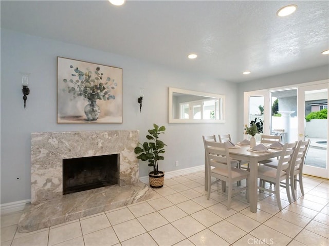 1163 Sandwood Pl, San Pedro, CA 90731 - dining space with baseboards, light tile patterned floors, recessed lighting, and a high end fireplace