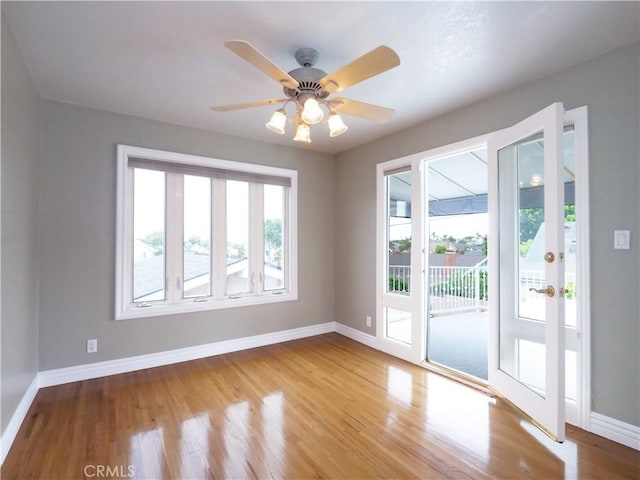 1163 Sandwood Pl, San Pedro, CA 90731 - empty room with plenty of natural light, baseboards, wood finished floors, and a ceiling fan