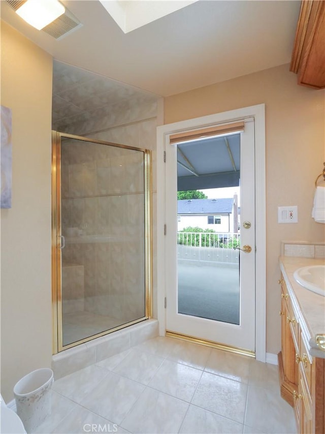 1163 Sandwood Pl, San Pedro, CA 90731 - bathroom featuring vanity, a stall shower, tile patterned flooring, and baseboards