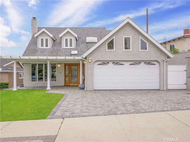 1163 Sandwood Pl, San Pedro, CA 90731 - view of front of home featuring stucco siding, a chimney, a front yard, decorative driveway, and a shingled roof