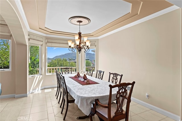 43845 Calle De Velardo, Temecula, CA 92592 - dining area with a tray ceiling, a chandelier, plenty of natural light, light tile patterned flooring, and ornamental molding