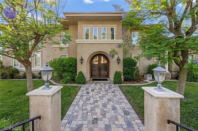 43845 Calle De Velardo, Temecula, CA 92592 - view of front of home featuring french doors, stucco siding, and a front yard
