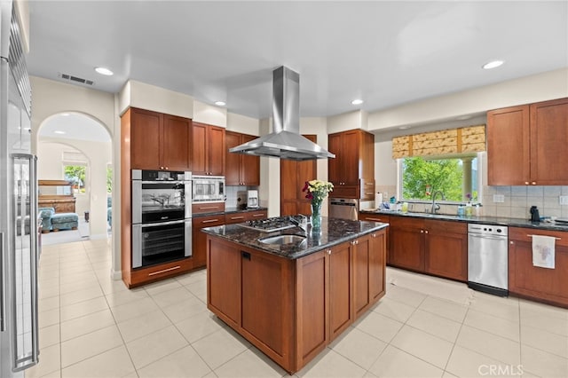 43845 Calle De Velardo, Temecula, CA 92592 - kitchen featuring wall chimney range hood, stainless steel appliances, decorative backsplash, a kitchen island, and recessed lighting