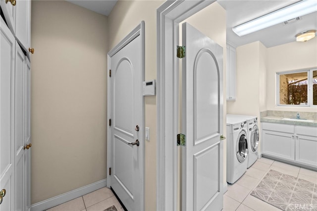 43845 Calle De Velardo, Temecula, CA 92592 - laundry area featuring independent washer and dryer, cabinet space, and light tile patterned floors