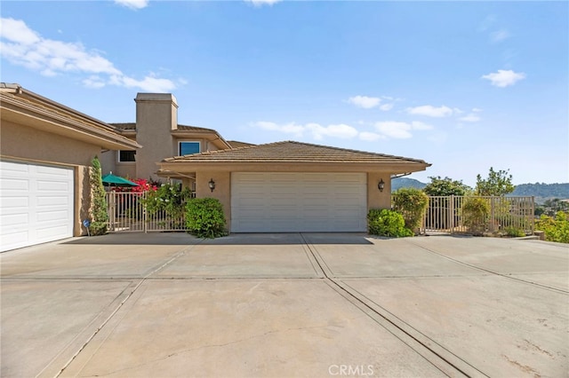 43845 Calle De Velardo, Temecula, CA 92592 - view of front of house with driveway, stucco siding, and a tile roof