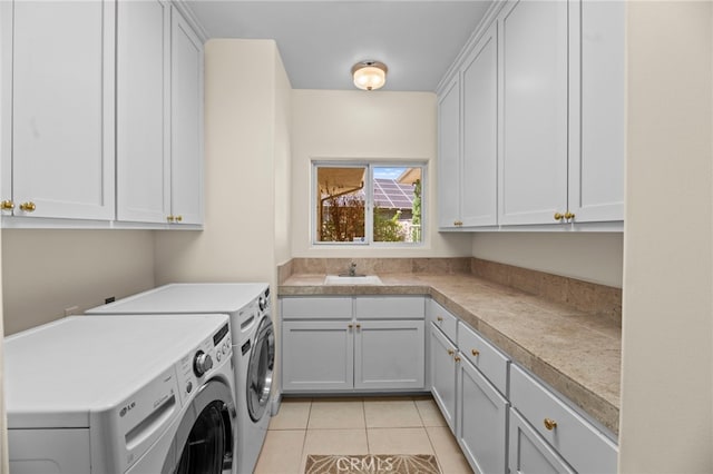 43845 Calle De Velardo, Temecula, CA 92592 - laundry area featuring washer and clothes dryer, cabinet space, and light tile patterned floors