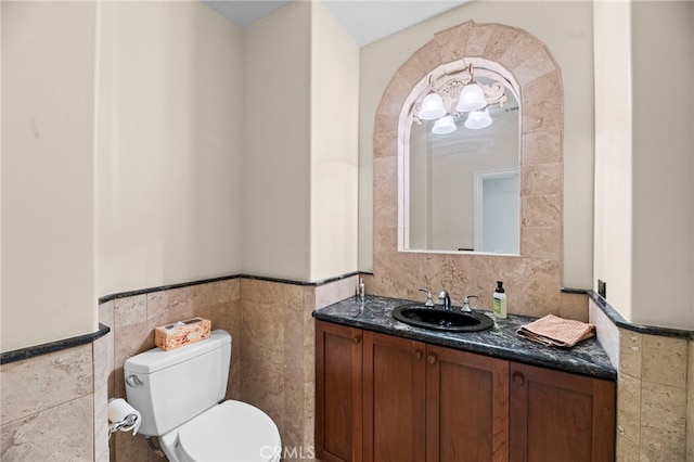43845 Calle De Velardo, Temecula, CA 92592 - bathroom with tile walls, wainscoting, and vanity