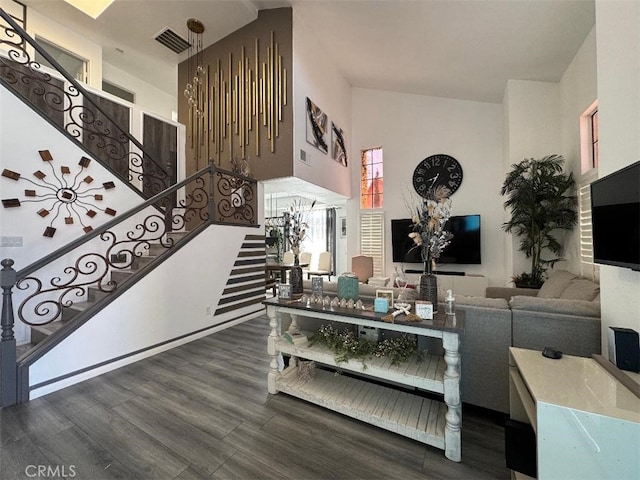 12477 Redrock Ct, Victorville, CA 92392 - living room featuring stairway, wood finished floors, and a towering ceiling