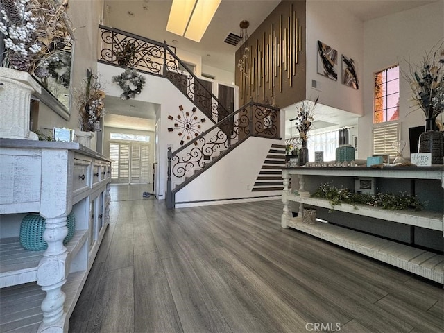 12477 Redrock Ct, Victorville, CA 92392 - living area with stairway, a high ceiling, and wood finished floors