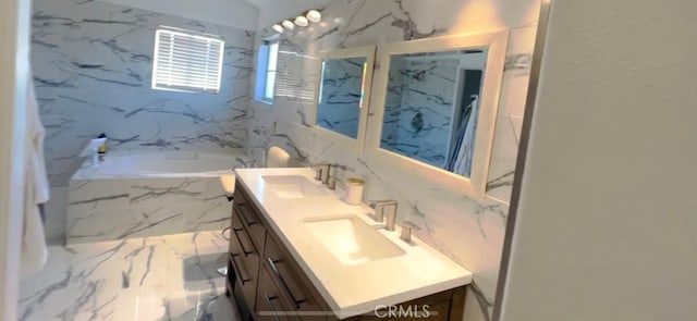 12477 Redrock Ct, Victorville, CA 92392 - full bath with a tub with marble appearance, double vanity, a marble finish shower, and marble finish flooring