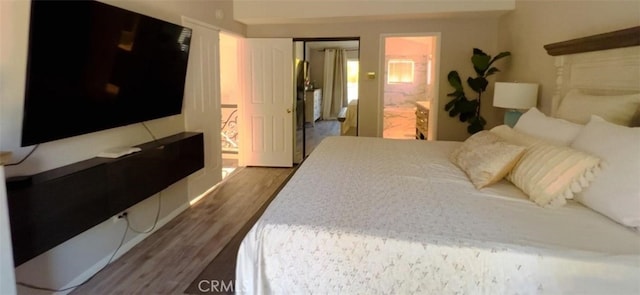 12477 Redrock Ct, Victorville, CA 92392 - bedroom featuring wood finished floors, ensuite bath, and a closet