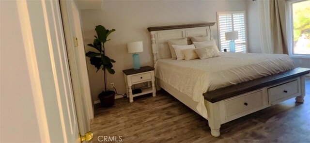 12477 Redrock Ct, Victorville, CA 92392 - bedroom featuring multiple windows and wood finished floors