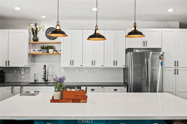 4941 Catamaran St, Oxnard, CA 93035 - kitchen with freestanding refrigerator, a sink, tasteful backsplash, white cabinetry, and recessed lighting