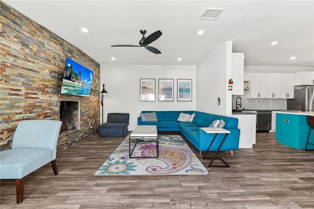4941 Catamaran St, Oxnard, CA 93035 - living room with ceiling fan, wood finished floors, recessed lighting, and a fireplace