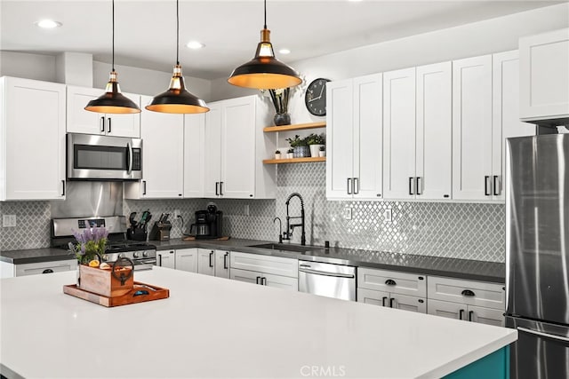 4941 Catamaran St, Oxnard, CA 93035 - kitchen featuring appliances with stainless steel finishes, a sink, white cabinets, and recessed lighting