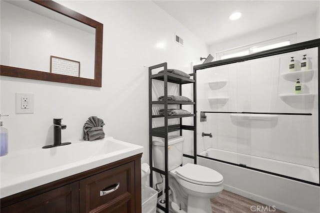 4941 Catamaran St, Oxnard, CA 93035 - bathroom with toilet, vanity, wood finished floors, and enclosed tub / shower combo