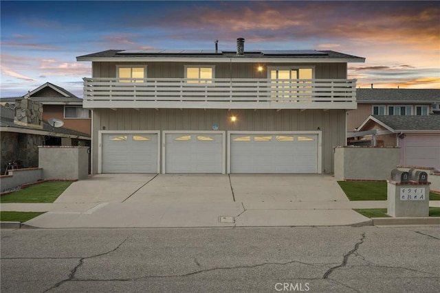 4941 Catamaran St, Oxnard, CA 93035 - multi unit property with a balcony, concrete driveway, and roof mounted solar panels