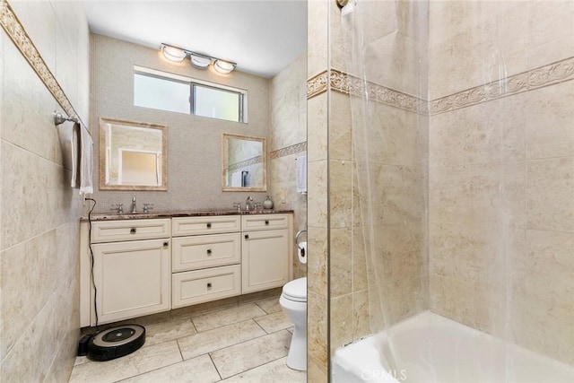 5741 Tobias Ave, Sherman Oaks, CA 91411 - bathroom with tile walls, toilet, double vanity, shower / bath combination, and tile patterned floors