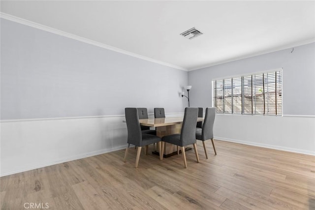 5741 Tobias Ave, Sherman Oaks, CA 91411 - dining space featuring wood finished floors, crown molding, and baseboards