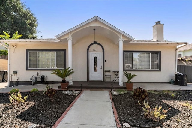 5741 Tobias Ave, Sherman Oaks, CA 91411 - view of front of house featuring a chimney, stucco siding, and a patio area