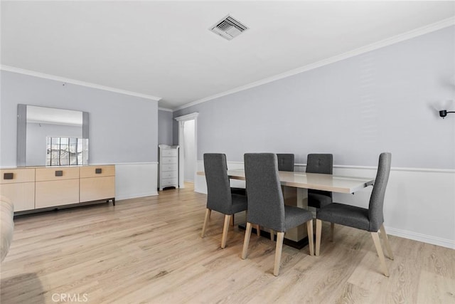 5741 Tobias Ave, Sherman Oaks, CA 91411 - dining area with light wood-type flooring, crown molding, and baseboards