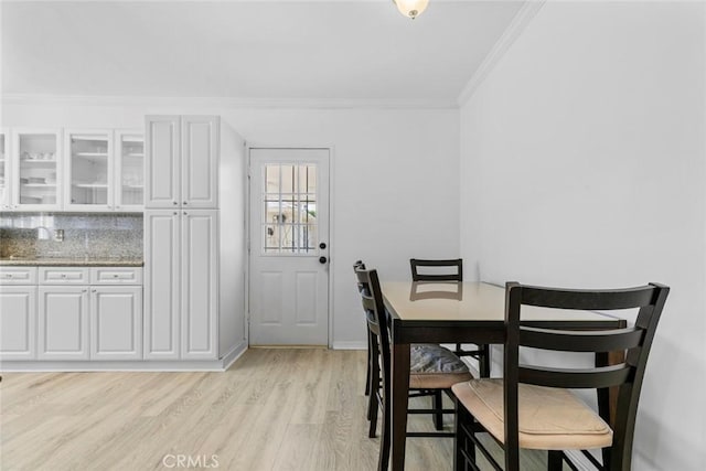 5741 Tobias Ave, Sherman Oaks, CA 91411 - dining space with ornamental molding and light wood finished floors