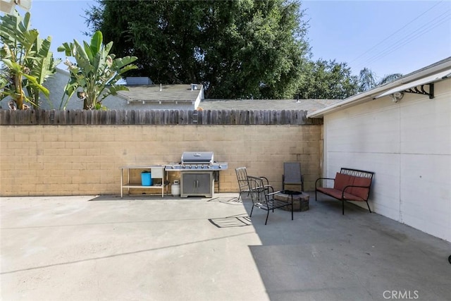 5741 Tobias Ave, Sherman Oaks, CA 91411 - fenced backyard featuring a patio area and a grill