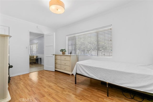 5741 Tobias Ave, Sherman Oaks, CA 91411 - bedroom with ornamental molding, light wood finished floors, and baseboards